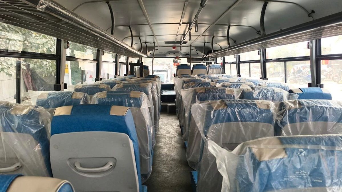 Interior seating of an air-conditioned private bus available for group hire in Delhi NCR